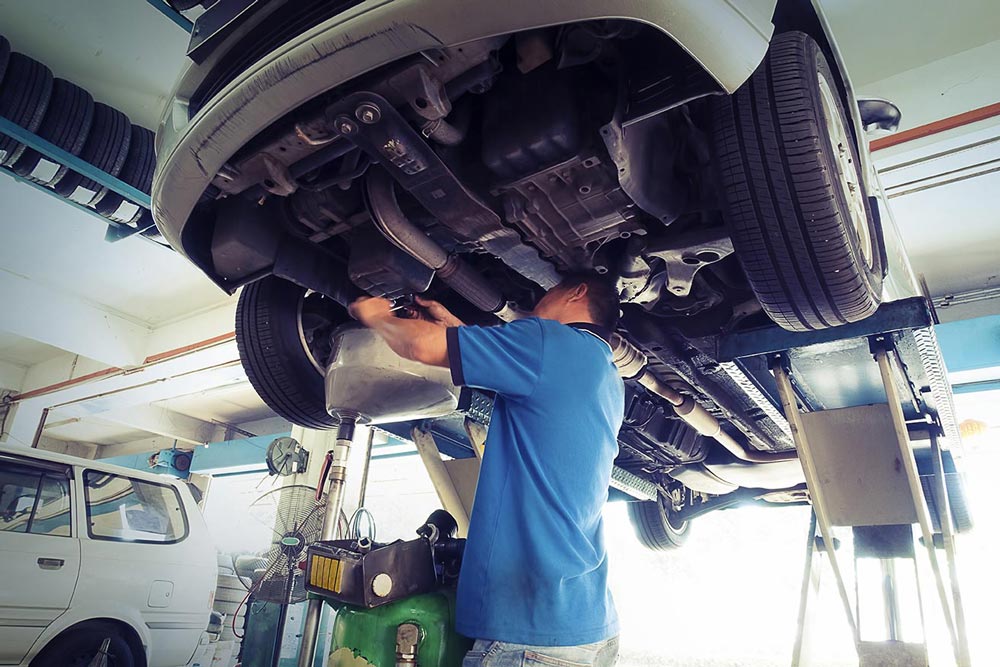 Mechanic Working on a Car