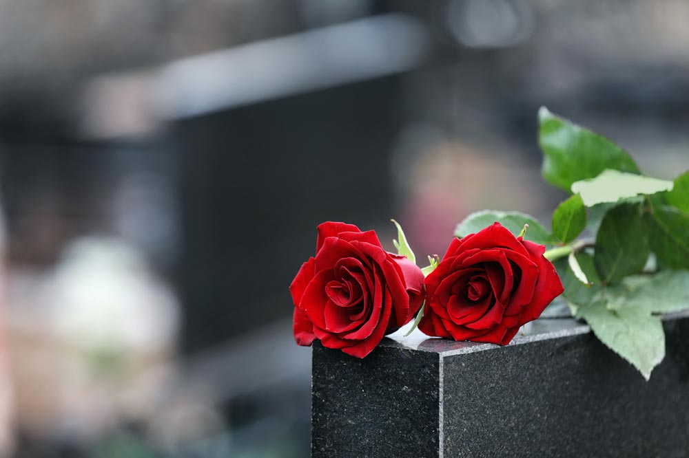 Roses on Grave after Wrongful Death Accident